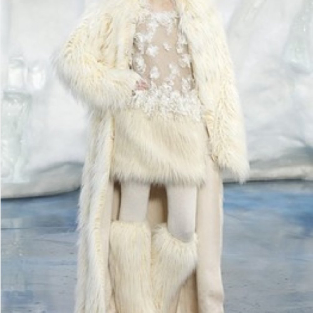 Gucci fur knee high boots.